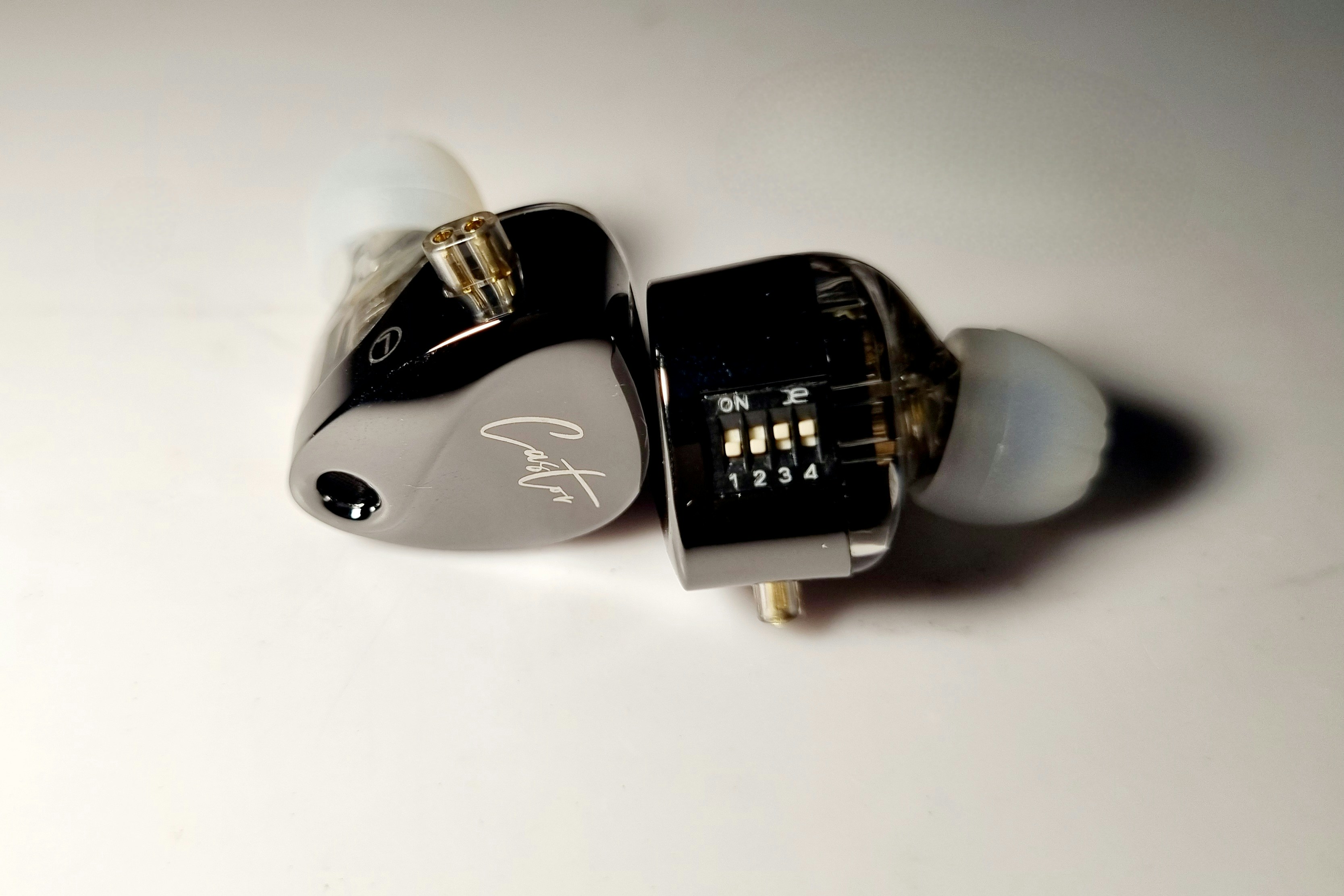 Four-position tuning switches on an AJX in-ear monitor shell